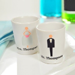 If lifes a party, then let our Custom Bride & Groom Shot Glasses (Set of 2) be your favorite toasting accessory! Designed with the newlywed couple in mind and featuring a super cute bride and groom illustration and free personalization, these souvenir shot glasses are the perfect wedding day present. And because theyre sold in sets of two and crafted of reusable ceramic, they will easily be cherished throughout the years as a one of a kind keepsake! So, raise them up high and cheers to many years of happiness!