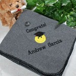 Express your pride and happiness for the new graduate with an Embroidered Graduation Throw Blanket. This fun and smiley fleece blanket is a perfect Grad Gift celebrating this accomplishment. A warm personalized blanket to enjoy a football game in the stands or to cozy up with and read a good book. 