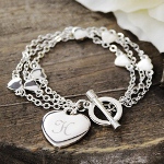 Make your wrist say, "Ooh La La!" with our Personalized Triple Strand Heart Bracelet. Chain linked hearts dance gracefully along this one of a kind toggle, making it an ideal blend of trend and tradition. Whether youre shopping for yourself or all your friends, let this amazing, customized bracelet be the first thing on your list! Includes a free organza gift pouch.  Great for 13th and 16th birthday gifts, junior bridesmaids and bridesmaids, graduation and prom gifts, holiday and daughter or granddaughter gift ideas.