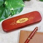 Your Sister means to the world to you. She is there when times are good and bad. She is there to listen and help. Give your loving Sister, her own Personalized Sister Pen Set to remember all of the good times the two of you have enjoyed together. An Engraved Pen Set is a unique work of art created especially for her. Engraved Pen Set for your Sister is presented with a matching rosewood case for convenient storage and a beautiful gift presentation. Pen measures 6" in length, black ink and features twist action ballpoint operation. The pen can be refilled with a standard Parker refill. The Engraved Sister Pen Case is personalized with any two line custom message. (i.e. I am glad you are my sister and my friend / Love Jessica )