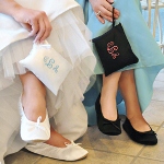 Once you remove our Ballet Shoes from their Embroidered Gift Pouch, youll have the pleasure of slipping your feet into stylish flats that are as chic as they are comfortable. As one of the hottest trends on the market, these satin dancing shoes are a great gift for everyone from bridesmaids and sorority sisters to family and friends and great for prom night. Theres no doubt; every girl will love her slippers for their notable style, as well as their universal appeal! And because of their high comfort level and flexible soles, these glorified ballet slippers are ideal for dancing the night away at wedding receptions or simply relaxing around the house. Available in White (W) and Black (B) and four different sizes, these fun footies are the perfect fit every time!