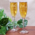 Personalized Wedding Couple Toasting Flutes - Personalized Bride & Groom Champagne Glasses You are now husband and wife. A union made to last a lifetime. Enjoy your first sip of champagne together as the new Mr. & Mrs. with these Personalized Wedding Couple Flutes. Your Engraved Champagne Flutes are the perfect glasses for the perfect evening. Your Personalized Bride and Groom Champagne Glasses are available on Angelic Twisted Stem Toasting Flutes. The Personalized Champagne Flutes feature 12 knotted twist stems and measure 8 1/4”H. Champagne Flutes are made in the USA and hold 5.75 ounces. Includes FREE Personalization! Personalize your Wedding Couples Toasting Flutes with any family name and wedding date.