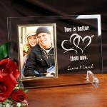 Celebrate a special occasion, anniversary our celebration with your loved one with our Two Is Better Than One Personalized Frame. Our Personalized Two is Better Than One Beveled Glass Picture Frame is a heavy-weight glass with beveled edges on all sides, accented with golden brass frame trim. Frame measures 8" x 11" and holds your 4" x 6" photo; includes clear easel legs for top display. Includes FREE Personalization! personalize with any couples names.