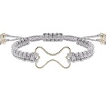 Sterling silver open bone bracelet in a hand-woven grey satin adjustable cord. One size fits most. To keep your bracelet strong and beautiful, keep dry.