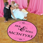 Joining of two hearts has never had a more beautiful representation than with our Mr. and Mrs. Wedding Dance Floor Decal! Fashioned with a wonderful mix of freshness, fashion and fun, this standout floor medallion has a look that will turn heads! Simply customize your decal at no charge to you by adding your new last name and one of this seasons hottest colors to your print. Itll be the perfect pop of customized style for your wedding reception celebration! Finished with removable, low stick materials, this vinyl decal includes a detailed instruction sheet for easy application and removal from nonporous surfaces. Available in two sizes: Standard (ST) and Large (LG).