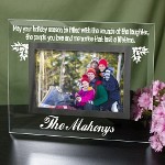 Make this Holiday season one to remember by creating your own Personalized Holiday Memories Picture Frame. A wonderful way to cherish lifes many experiences over and over again. Your Engraved Christmas Glass Picture Frame measures 9" x 7" and holds a 3.5" x 5" or 4" x 6" photo. Easel back allows for desk display. Includes FREE Personalization! Personalize you Holiday Memories Glass Picture Frame with any one line. (i.e. The Mahonys) 