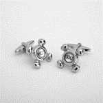 Think out of the box with our dashing selection of cufflinks featuring designs that are a bit out of the ordinary. This pair of Hot and Cold water faucet cufflinks comes packaged in an attractive personalized silver-tone case featuring the name of the recipient. These cufflinks make perfect groomsmen gifts and add a little pizzazz to any wedding attire. Light-weight plated polymer case measures 3" x 1 1/8" 1 1/2" and is lined in black satin. 