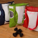 Stay hydrated at the gym, the office or at your favorite summertime event with our handy personalized H2O Bag. Large enough to hold your lunch, sunscreen, library books or gym clothes, this light-weight but spacious bag includes a crescent-shaped outer pocket for a snug fit of your water bottle or other beverages. Available in three vibrant colors, the bag is embroidered with one of our 10 signature thread colors. Measures 15" x 15". 
