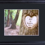 Remember the old days when lovers would carve their names in a tree trunk? With our Tree of Love image, you can enjoy that tender experience without the tree! This whimsical framed and matted image is a great gift for the newly engaged, the wedding couple, or even for a landmark anniversary celebration. No leaf raking necessary! Personalization includes two names and the date of that special occasion. Includes a custom black, beveled 23" x 19" wood frame with 3" mat and glass front. Matted image measures 13 3/4" x 11 3/4". Carve two names of up to 10 characters per name and add the date (MM/DD/YYYY format).