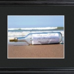 No mystery here! Our Message in a Bottle image announces your special event or sentiment loud and clear. This personalized image is handsomely framed and matted and ideal for expressing love, announcing a birth, or marking a landmark trip, like an island vacation or honeymoon. Personalization is in attractive script and includes 3 lines of up to 20 characters each. Includes a custom black, beveled 23" x 19" wood frame with 3" mat and glass front. Matted image measures 13 3/4" x 11 3/4". 