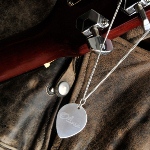 A clever addition to any jewelry collection, our personalized guitar pick necklace makes the perfect gift for your guitar-playing friends. This solid sterling silver pick is the real thing and hangs gracefully on a simple silver chain, making it suitable for men or women. A great conversation piece, this pick necklace is a unique gift for anyone who has a passion for strummin or pickin. Measures 1 1/8" x 1" with a 9" chain. Personalize with one line up to six characters.