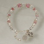Celebrate an upcoming wedding with a keepsake gift idea. The bracelet is made with pink and clear Swarvoski crystals, Bali silver beads, a silver lobster clasp and includes a dangle heart charm. Gift boxed with a poem card. Personalize your Bridal Party Bracelet with a single initial. ( ie. M ) Adjustable in size up to 7 1/2.