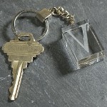 This contemporary crystal keychain makes for an attractive Engraved Keepsake for someone special. Celebrate a birthday, graduation, Mothers Day, or give these Personalized Initial Key Chains as a thoughtful mementos to the entire bridal party; the options are endless. Our Personalized Initial Crystal Key Chain measures 4.5" with key ring and the engraved crystal measures 1-1/4" x 15/`6" x 5/8". Includes FREE Engraving. Personalized your Crystal Keychain with any single initial. ( ie. V )