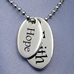 This double oval Faith & Hope pendant is similar to the pendant worn by Michelle Obama. Charm One is 1/2 by 7/8 inch. Charm Two is 1 1/8 by 5/8 inch. Includes 20 inch 2.5mm bead chain. 
