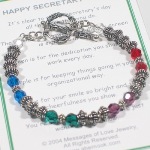 Treat your secretary or administrative professional to a gift that will be remembered. The bracelet is designed with swarovski crystals and bali silver. Each bracelet comes with a special poem. The words will be remembered each time the bracelet is worn. Poem can be specific to Secretarys Day or more generic as a gift for any day. A Thank You charm hangs by the toggle. 