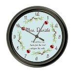 This beautiful wall clock will make a wonderful personalized gift that your teacher will love to hang in her classroom or display at home. This teacher wall clock is 10" in diameter and has a black plastic frame. Whether giving to a special teacher at the end of the school year or to a new teacher graduating, the Teacher Wall Clock gift is a keepsake gift idea. Personalization Information: Personalize this gift with a name, and special message.
