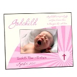 This pink godchild photo frame is a perfect way to celebrate a favorite godchilds christening or baptism. This sweet and sentimental picture frame holds a single 4" by 6" photograph and features the phrase "A godchild is a special gift sent from heaven above to bless your life with love." Each 8" by 10" glossy personalized picture frame has space for your goddaughters name and special date, and is a great way to capture a milestone in her young life. 