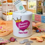 Collect and save all your money with this adorable Personalized Tiara Fund Jar. Our Custom Tiara Fund Coin Bank is perfect for your little princess who is saving for something special. Make it a great gift for your little one celebrating a birthday of any special occasion. 