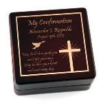 Our sleek wooden rosary box is perfect for a for a confirmation. This 3 3/8’’ x 3 ½’’ x 1 ½’’ rosary box features a shining cross, a dove and a message that reads “May God love with you and light your way. May he bless your heart each and every day”. 