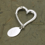 Not your ordinary key chain, this graceful personalized heart-shaped key holder is suitable for him or her and makes the perfect gift for the bride or groom or even an ideal wedding favor. Decorated with a simple tag featuring your chosen personalization, this silver-plated-over-brass key chain will keep shining for years to come. Measures 2 1/2" x 1/8". Personalized with three initials. 
