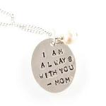 A petite 15x20mm sterling silver oval handstamped with the phrase "I am always with you" and a freshwater pearl dangle. Includes 18" sterling silver chain. Choose to have Mom engraved,another short name or left blank. 