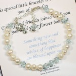 A wedding bouquet is a beautiful and meaningful part of your wedding day. The To the Bride bracelet is a great gift idea for the Maid of Honor, Bridesmaids or Parent(s) of the bride to give as a special and meaningful gift on the Wedding Day or as a Bridal Shower Gift. Wrap the bracelet around the bouquet and keep secure with decorative floral or hat pins. After the ceremony slip on as a reminder of your special day. The bracelet is created with sterling heart chain, freshwater pearls, clear crystals and blue crystals for that needed "something blue". Poem card can be customized to include a special message. 